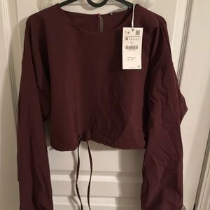 Zara cropped burgundy long sleeve top with ties around wrists & bottom of shirt